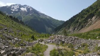 Aerial View of Woman Hiking in Svaneti Mountains Female Trekker Explores Rugged...